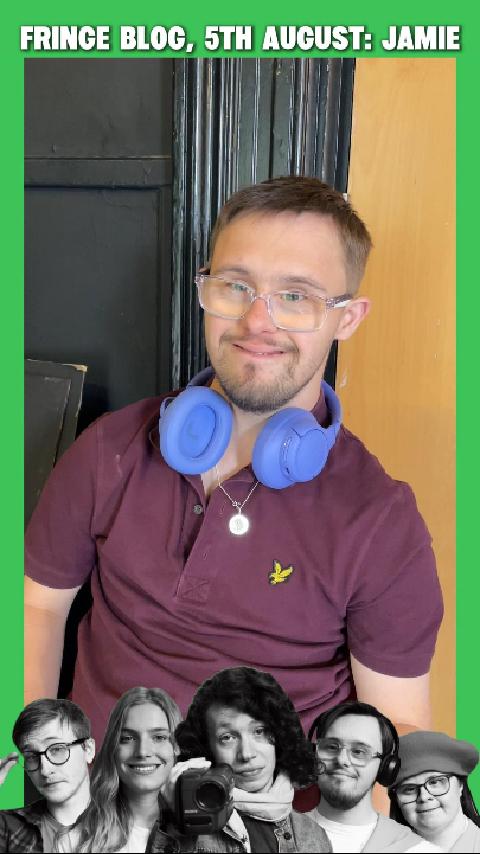 Jamie, a white man with brown hair and Downs syndrome smiles at the camera. He is wearing a purple top and bright purple headphones.