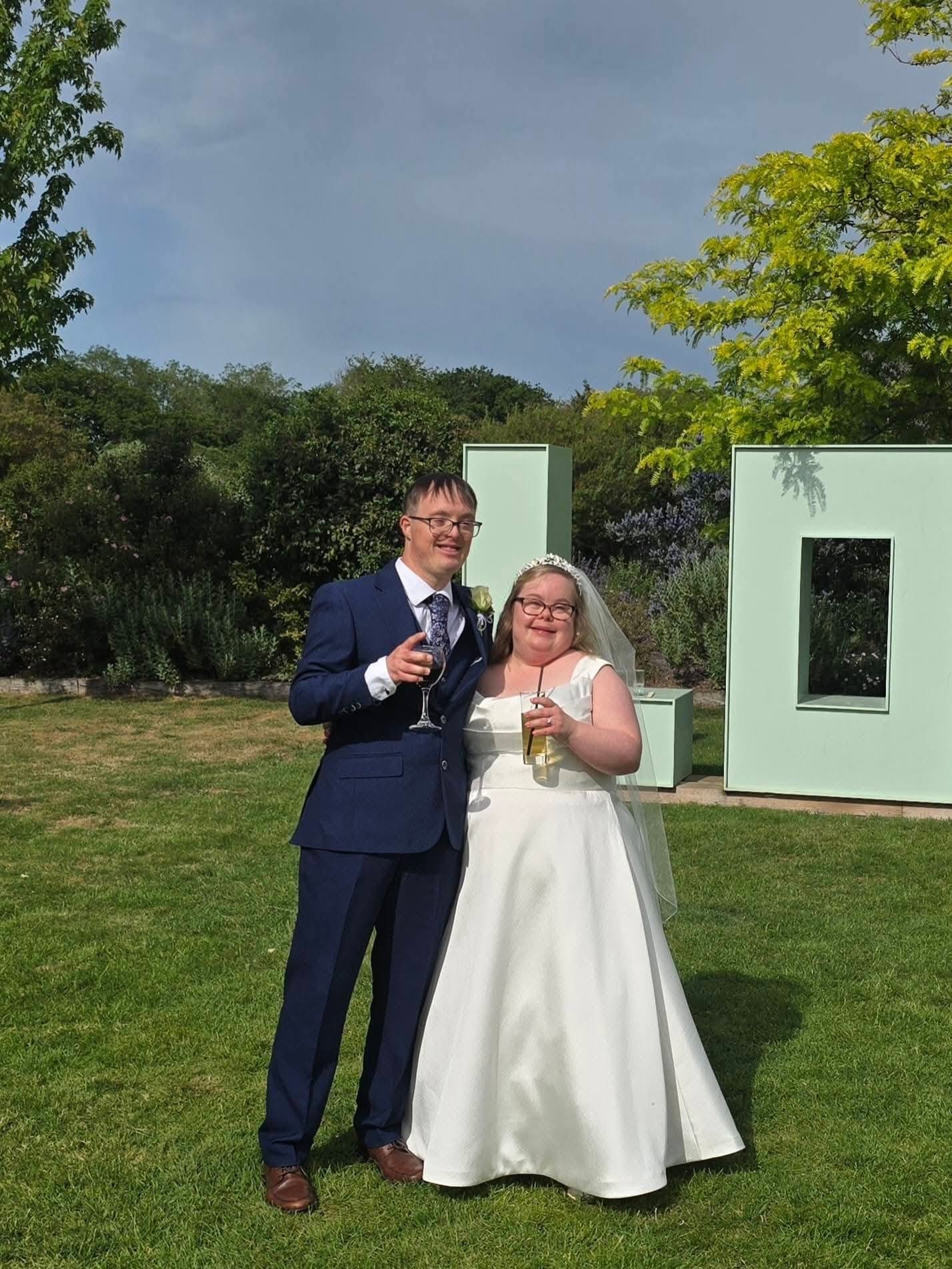 Two Bedazzle Community Theatre performers celebrating their wedding